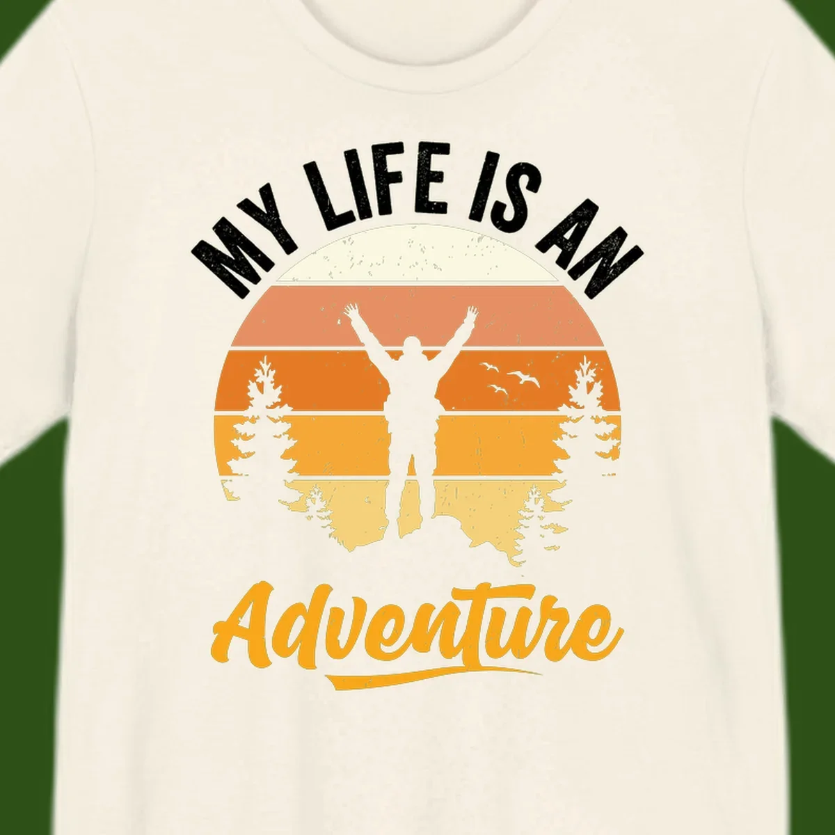 Retro sunset illustration with silhouette of person celebrating arms raised, evergreen trees and mountains, text 'My Life Is An Adventure'