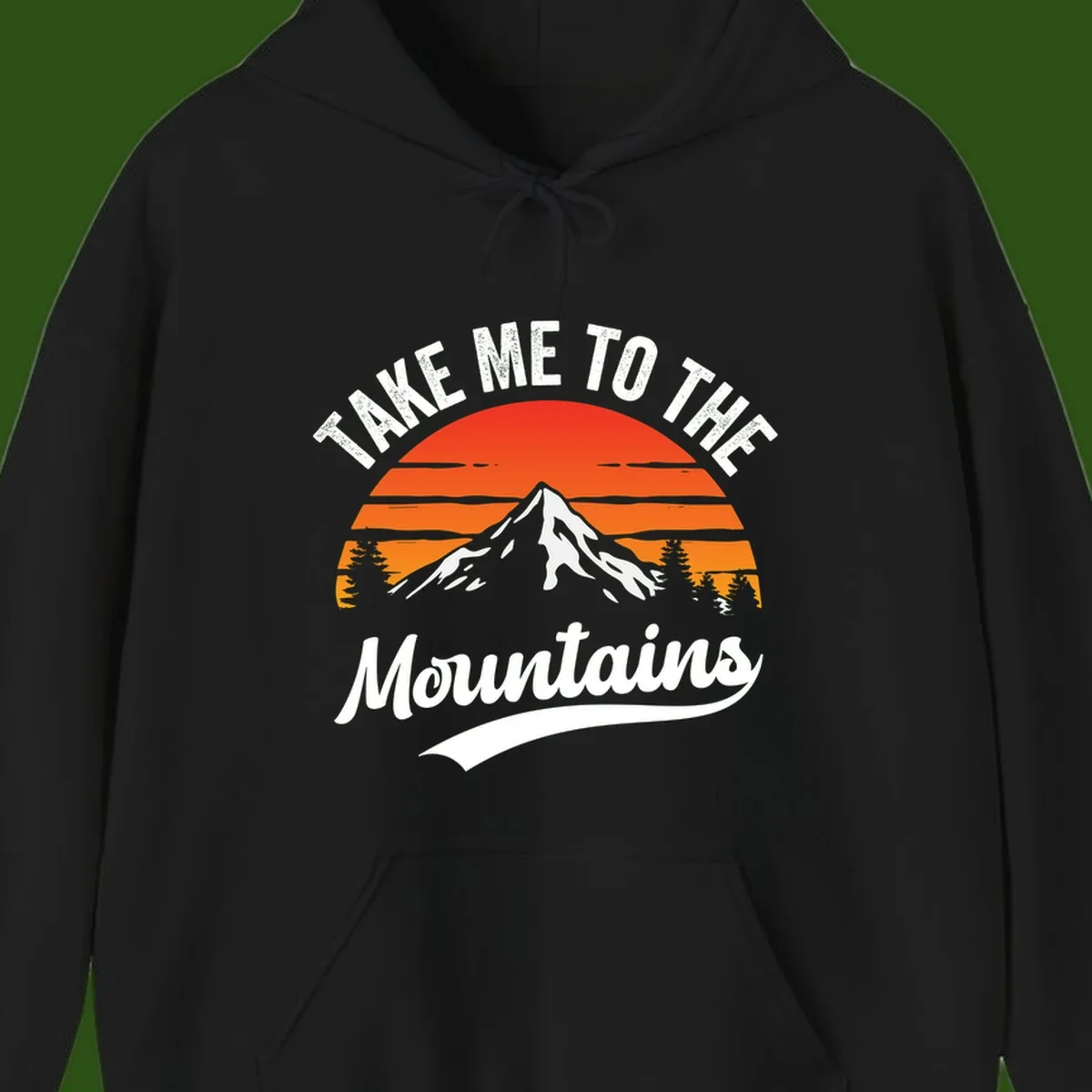 Vintage-style illustration of snow-capped mountain with sunset stripes and evergreen trees, text reading 'Take Me To The Mountains'