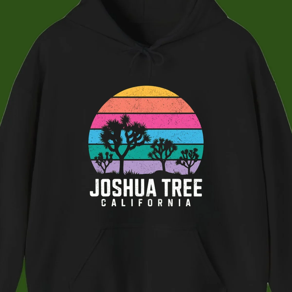Joshua tree desert stripes design with silhouetted trees across rainbow horizontal color bands and distressed texture.