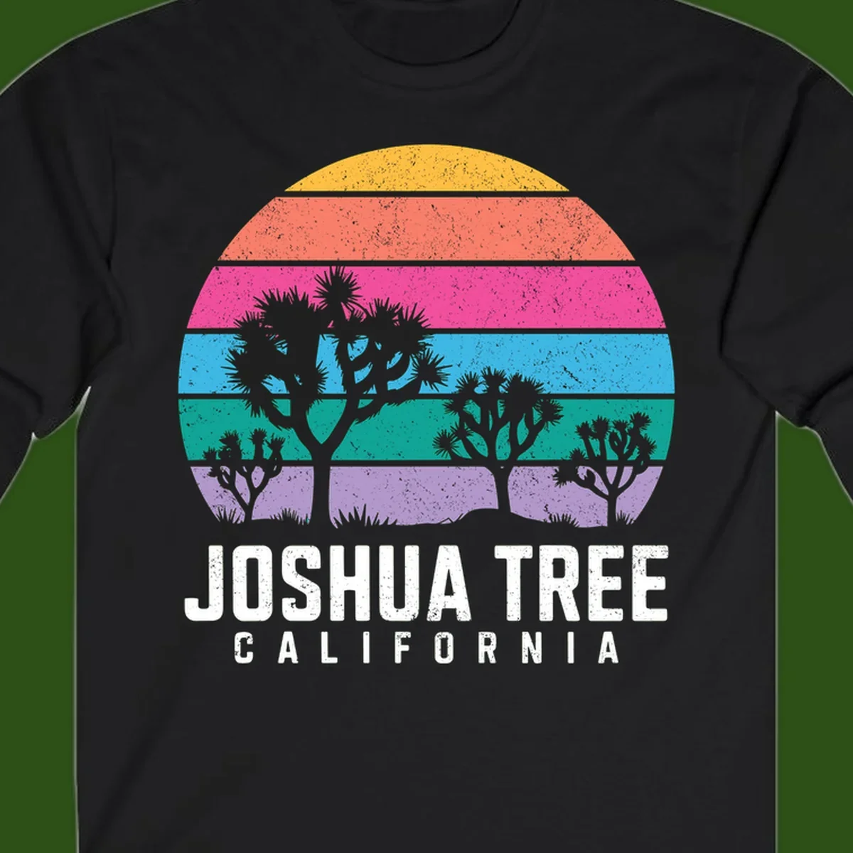 Joshua tree desert stripes design with silhouetted trees across rainbow horizontal color bands and distressed texture.