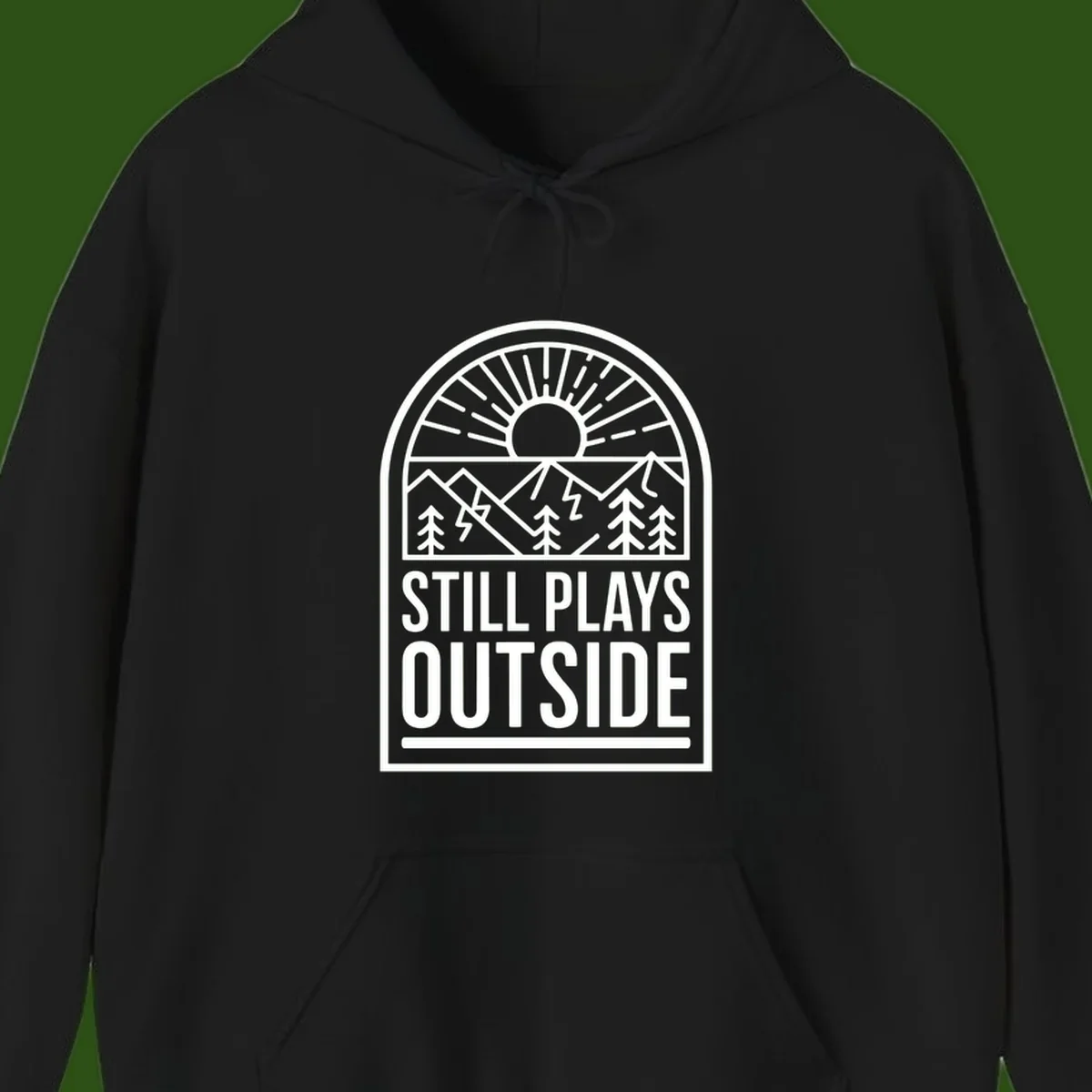 Still Plays Outside badge design featuring mountains, sun, pine trees, and lightning bolt in minimalist line art style