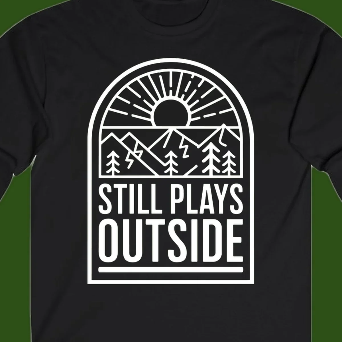 Still Plays Outside badge design featuring mountains, sun, pine trees, and lightning bolt in minimalist line art style