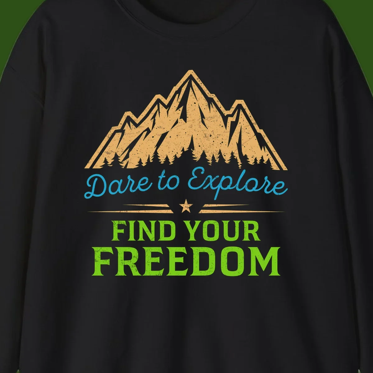 Mountain landscape with pine trees in gold, blue script 'Dare to Explore' and green text 'Find Your Freedom' with decorative star