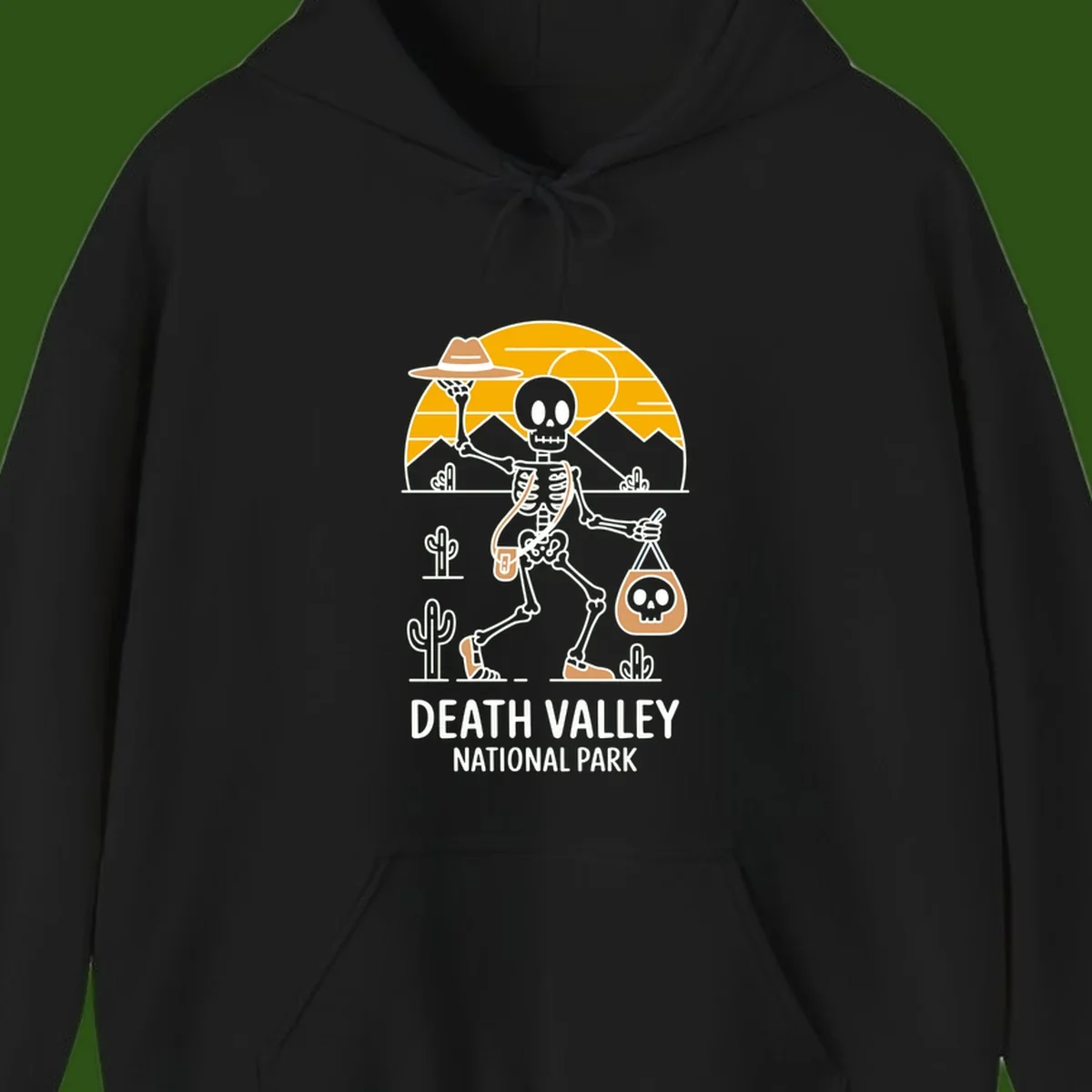 Skeleton cowboy holding skull pouch in Death Valley desert landscape with cacti, mountains, and golden sun rays