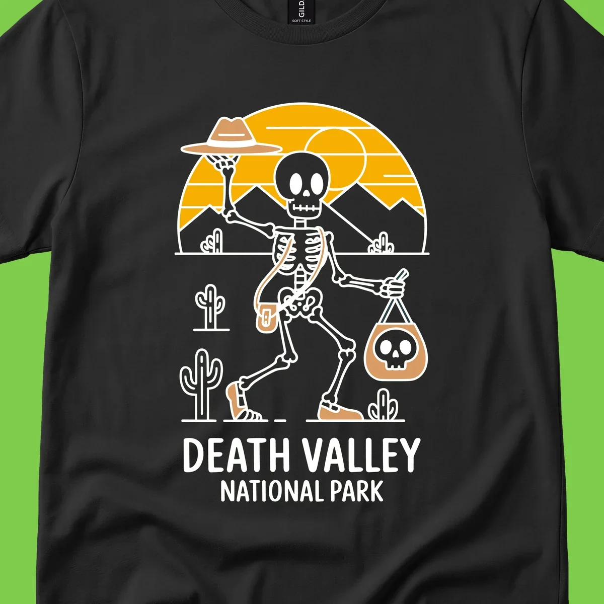 Skeleton cowboy holding skull pouch in Death Valley desert landscape with cacti, mountains, and golden sun rays