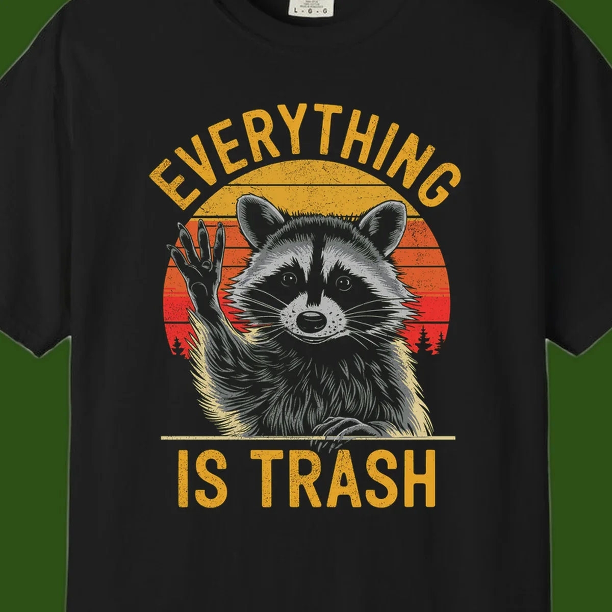 Vintage-style illustration of a raccoon with raised paw against retro sunset stripes, text reading 'Everything Is Trash' in distressed gold lettering