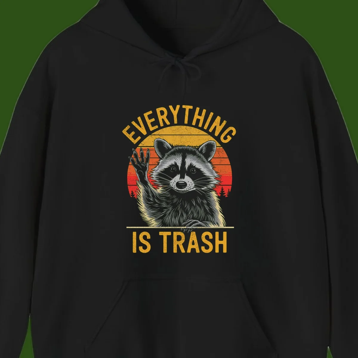 Vintage-style illustration of a raccoon with raised paw against retro sunset stripes, text reading 'Everything Is Trash' in distressed gold lettering
