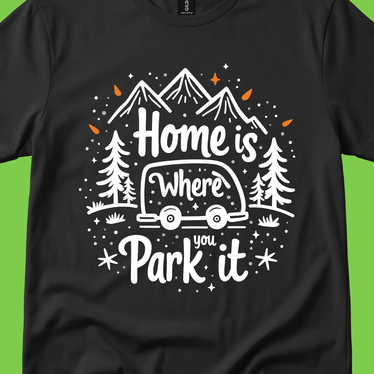 Illustrated winter camping scene with travel trailer, mountains, trees, and snowflakes with text 'Home is Where you Park it'