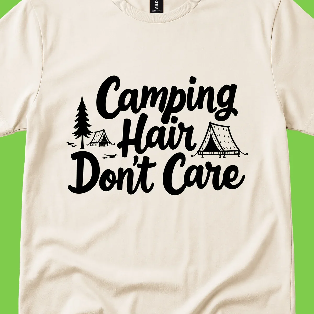 White text reading 'Camping Hair Don't Care' with illustrated tent and evergreen tree designs on gray background