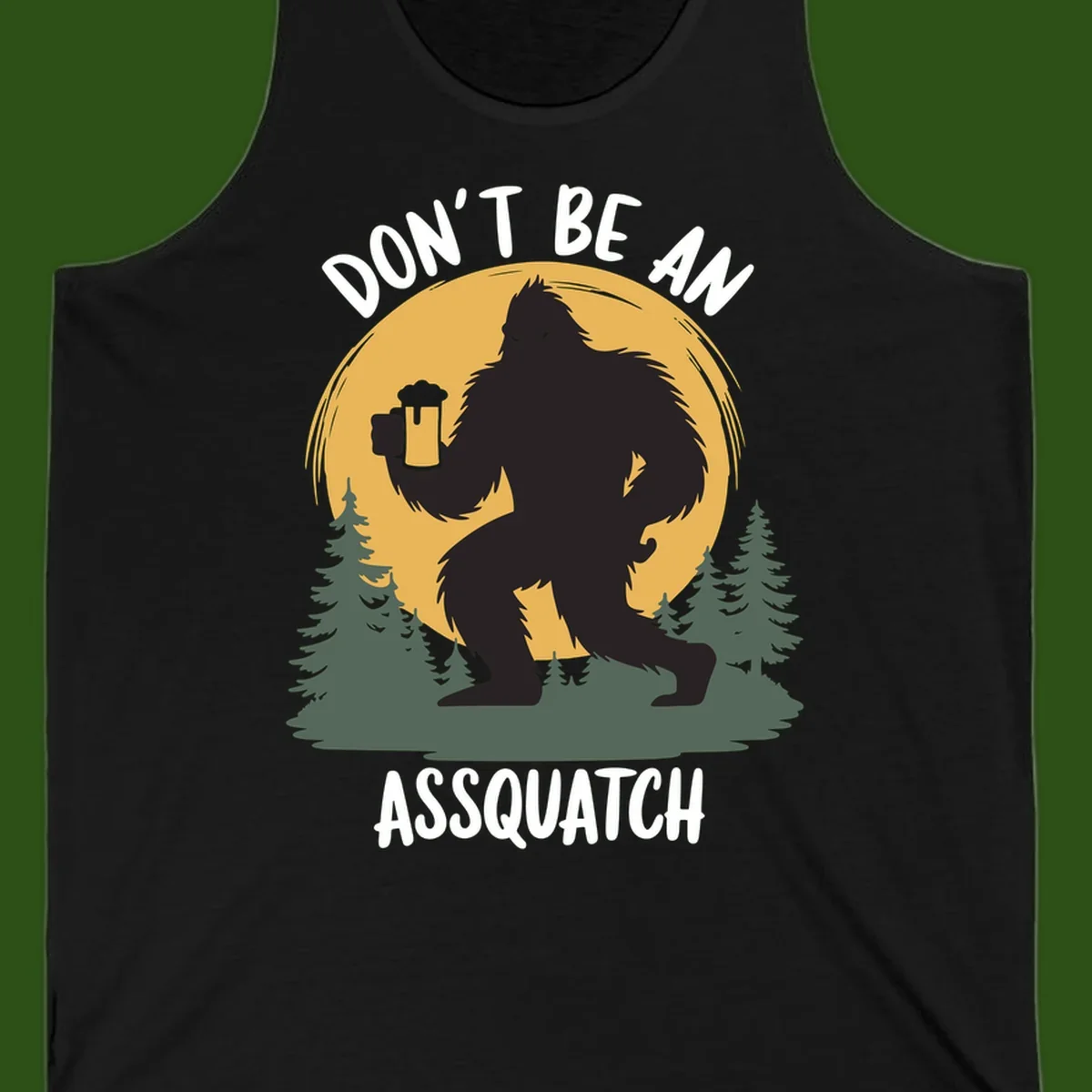 Black silhouette of Bigfoot holding a beer mug under a full moon with pine trees, text reads don't be an assquatch