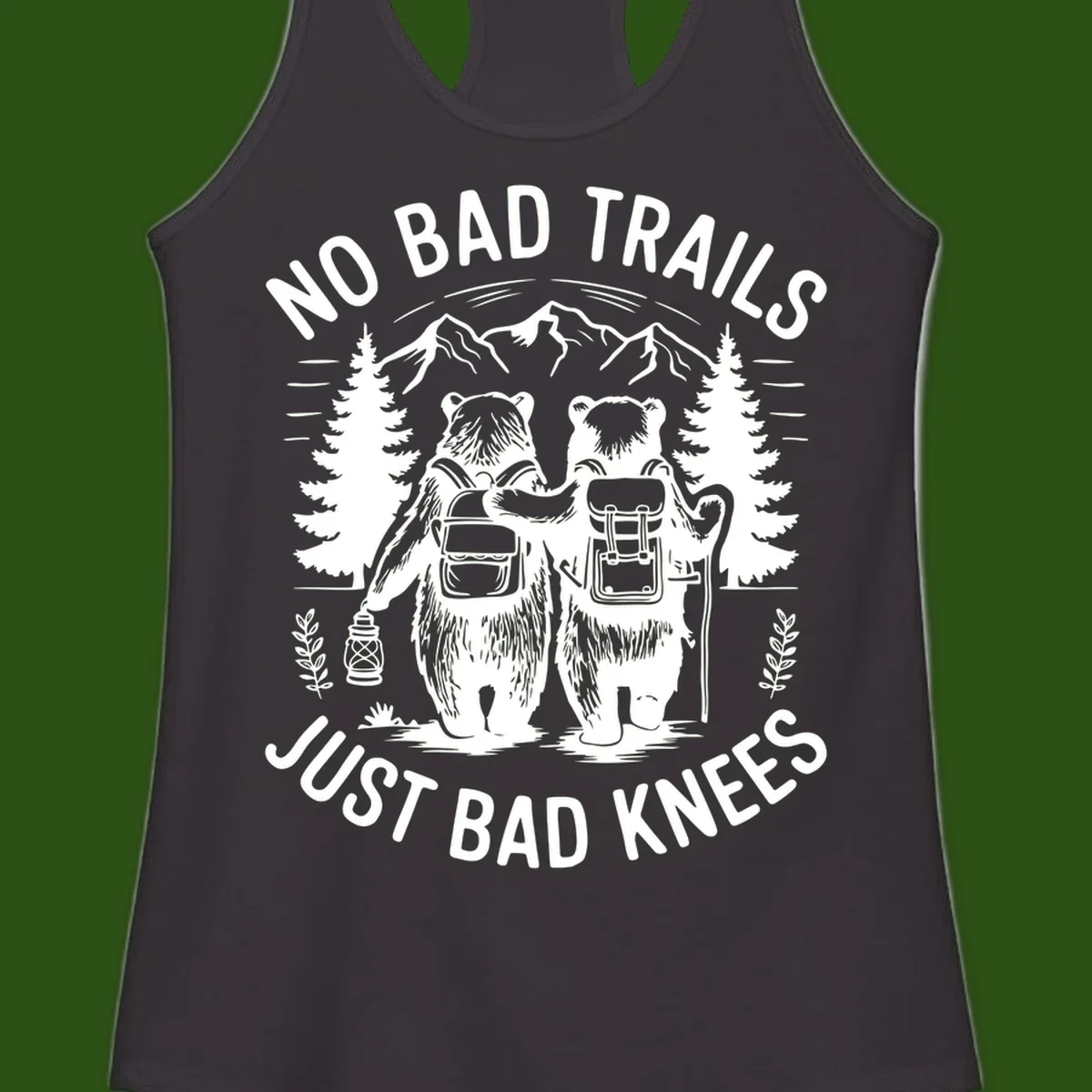 Two cartoon bears with backpacks hiking in mountains with text 'No Bad Trails Just Bad Knees' - humorous outdoor camping design
