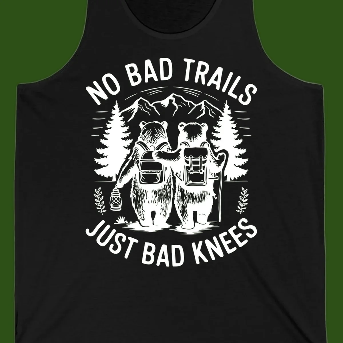 Two cartoon bears with backpacks hiking in mountains with text 'No Bad Trails Just Bad Knees' - humorous outdoor camping design