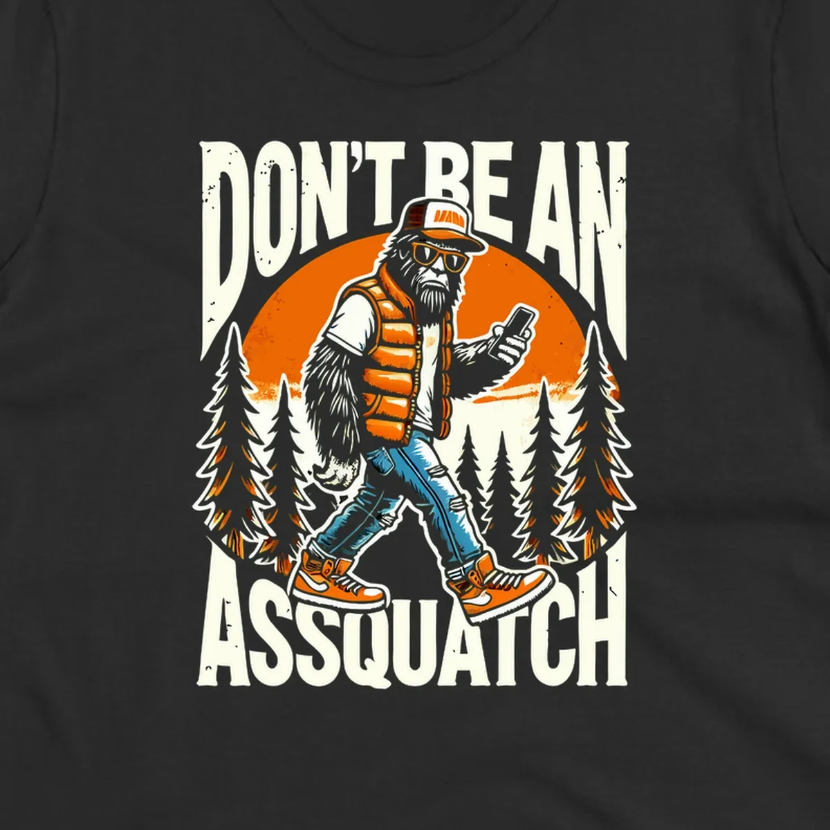Cartoon sasquatch in hiking gear with backpack and smartphone, 'Don't Be An Assquatch' text, forest and orange sun background.