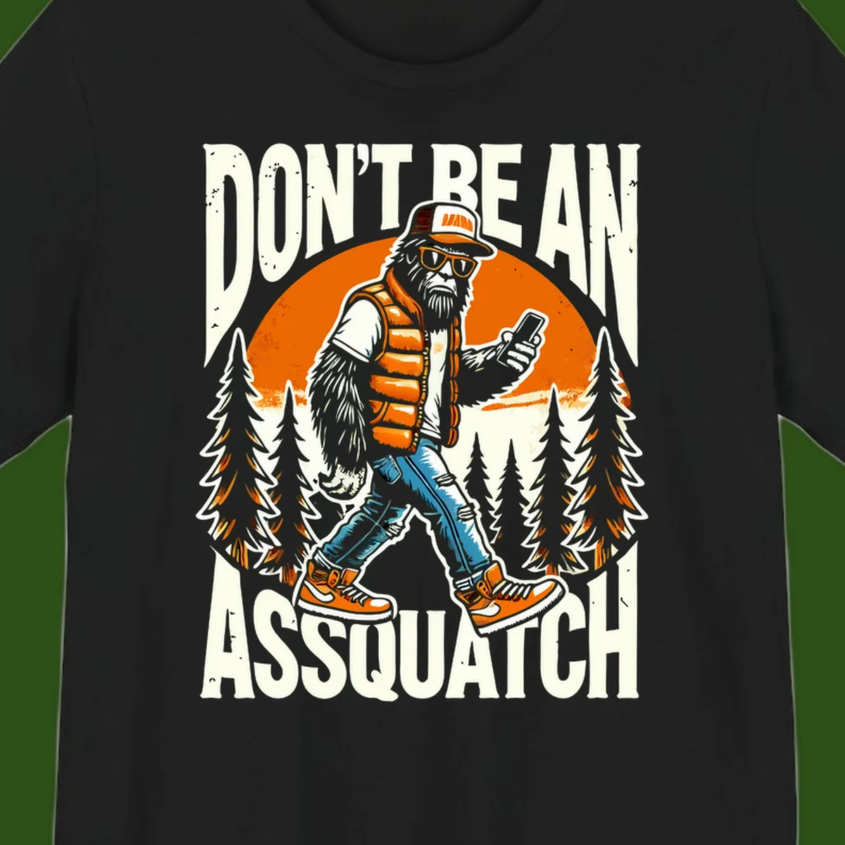 Cartoon sasquatch in hiking gear with backpack and smartphone, 'Don't Be An Assquatch' text, forest and orange sun background.