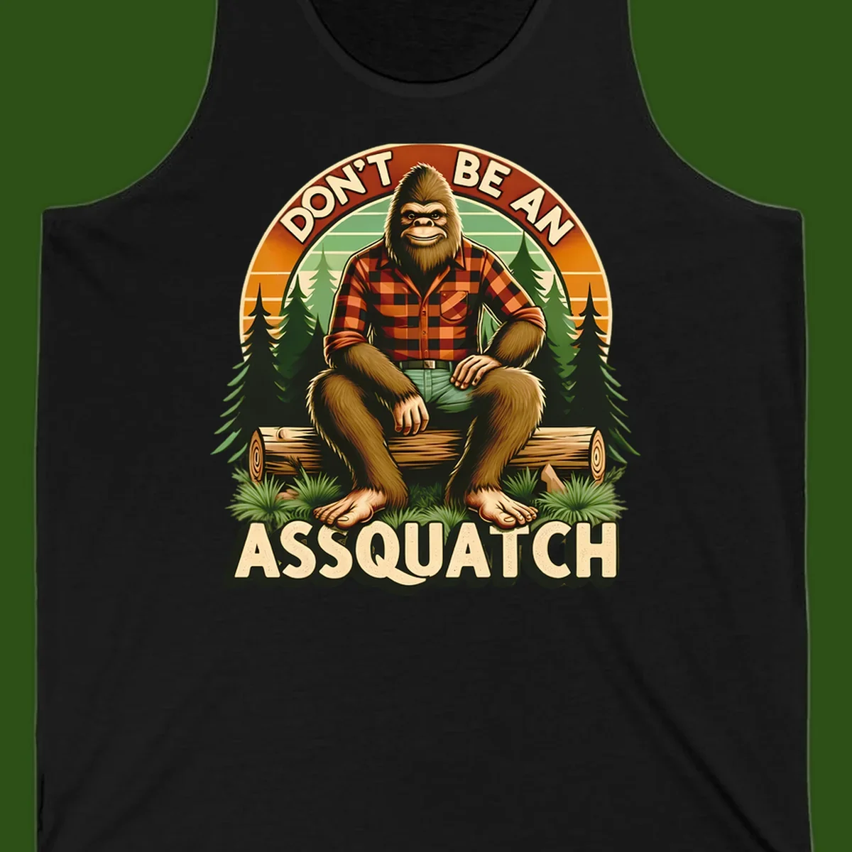 Vintage badge design with friendly Bigfoot in plaid shirt sitting on a log with forest trees, text reads 'Don't Be An Assquatch'