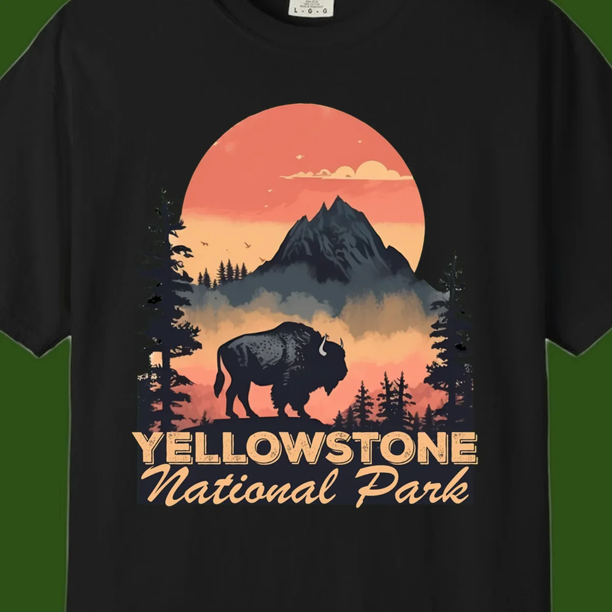 Yellowstone bison national park design: silhouette of a bison in misty forest with mountain peak and sunset sky