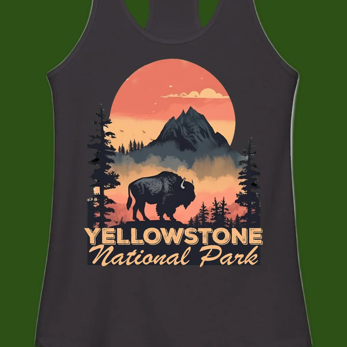Yellowstone bison national park design: silhouette of a bison in misty forest with mountain peak and sunset sky