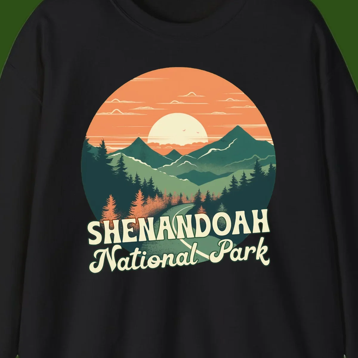Vintage-style illustration of Shenandoah National Park with layered mountains, evergreen forests, and a large orange sunset sky with text reading Shenandoah National Park.