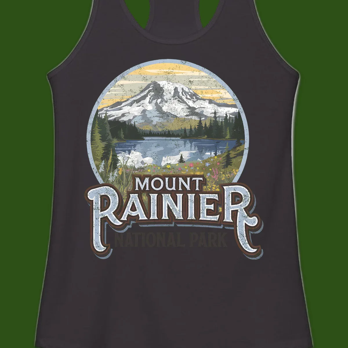 Vintage Mount Rainier National Park badge design with snow-capped peak, alpine lake, evergreen forest, and wildflowers on distressed background