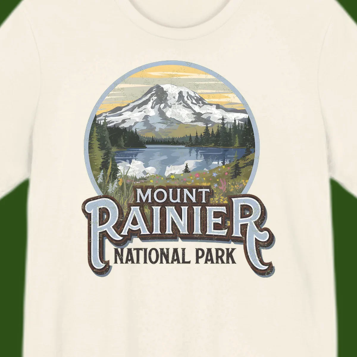 Vintage Mount Rainier National Park badge design with snow-capped peak, alpine lake, evergreen forest, and wildflowers on distressed background
