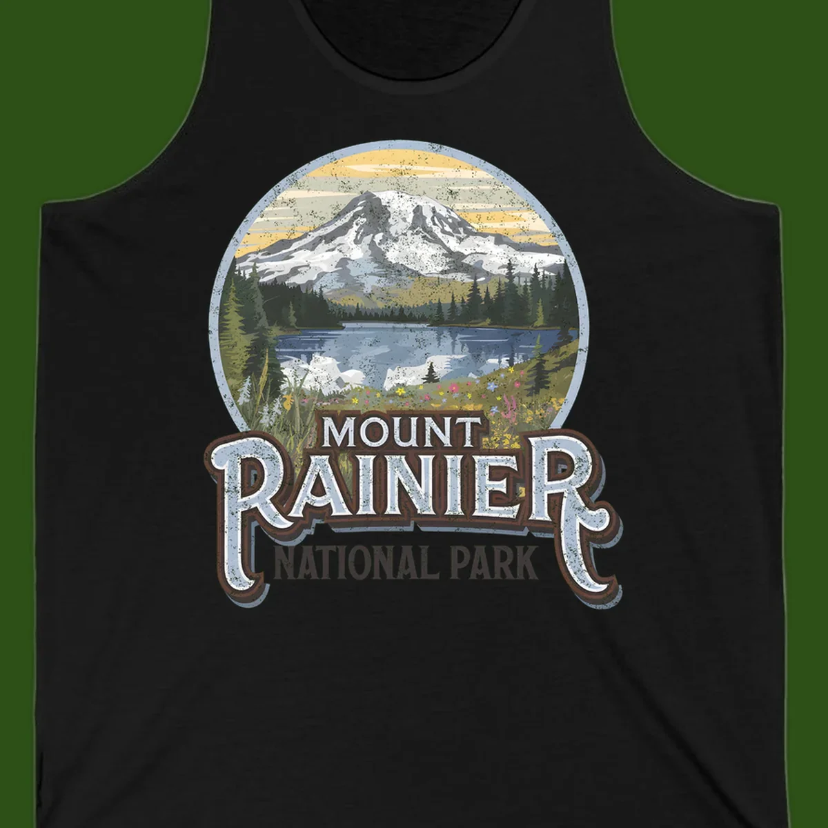 Vintage Mount Rainier National Park badge design with snow-capped peak, alpine lake, evergreen forest, and wildflowers on distressed background