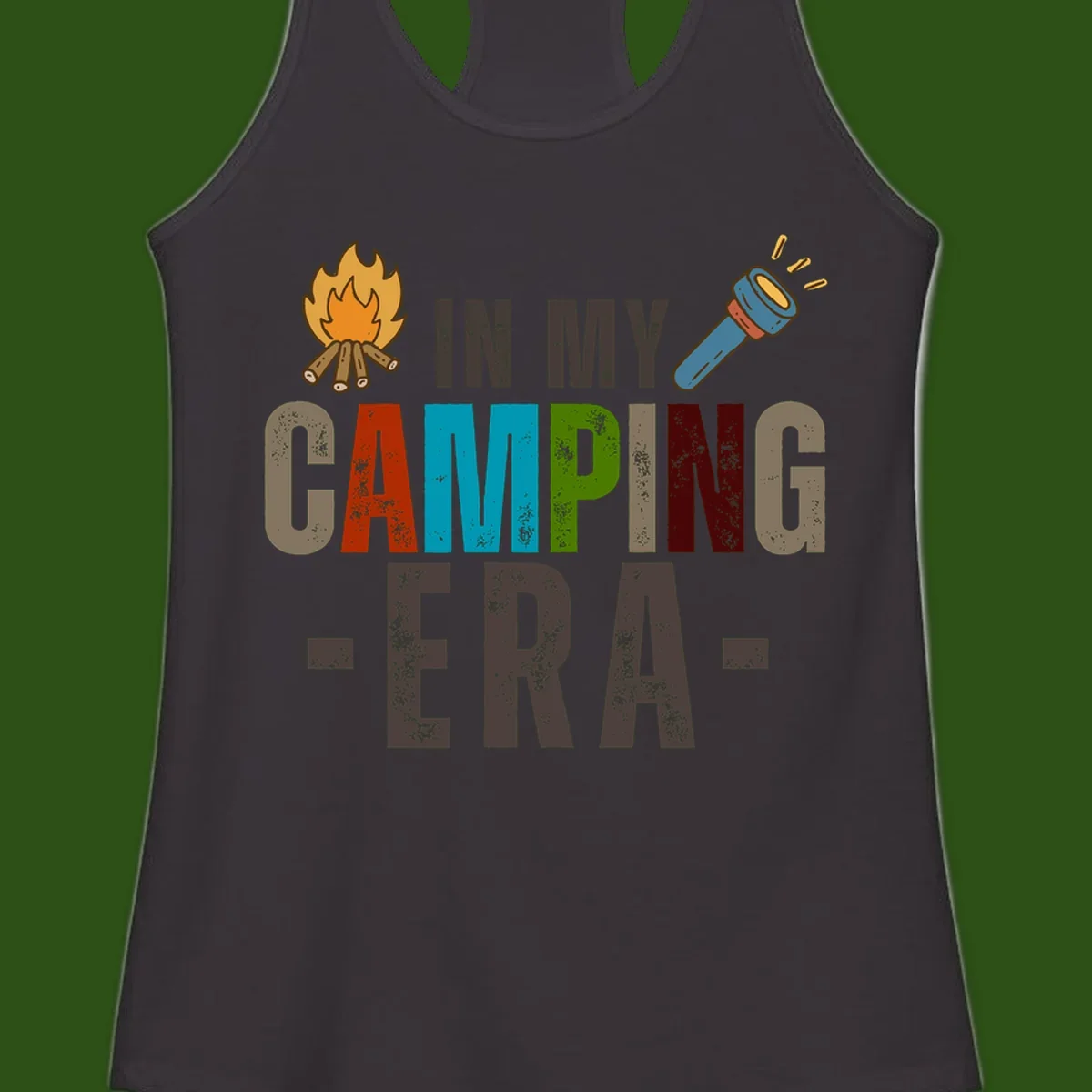 Campfire and flashlight icons flank colorful distressed text reading 'In My Camping Era' on gray background