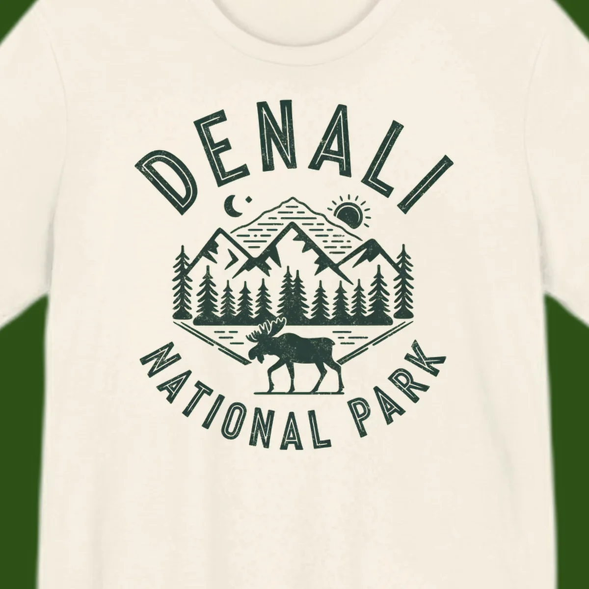Denial National Park badge design with moose walking through forest, mountains, sun and moon with crossed fishing rods