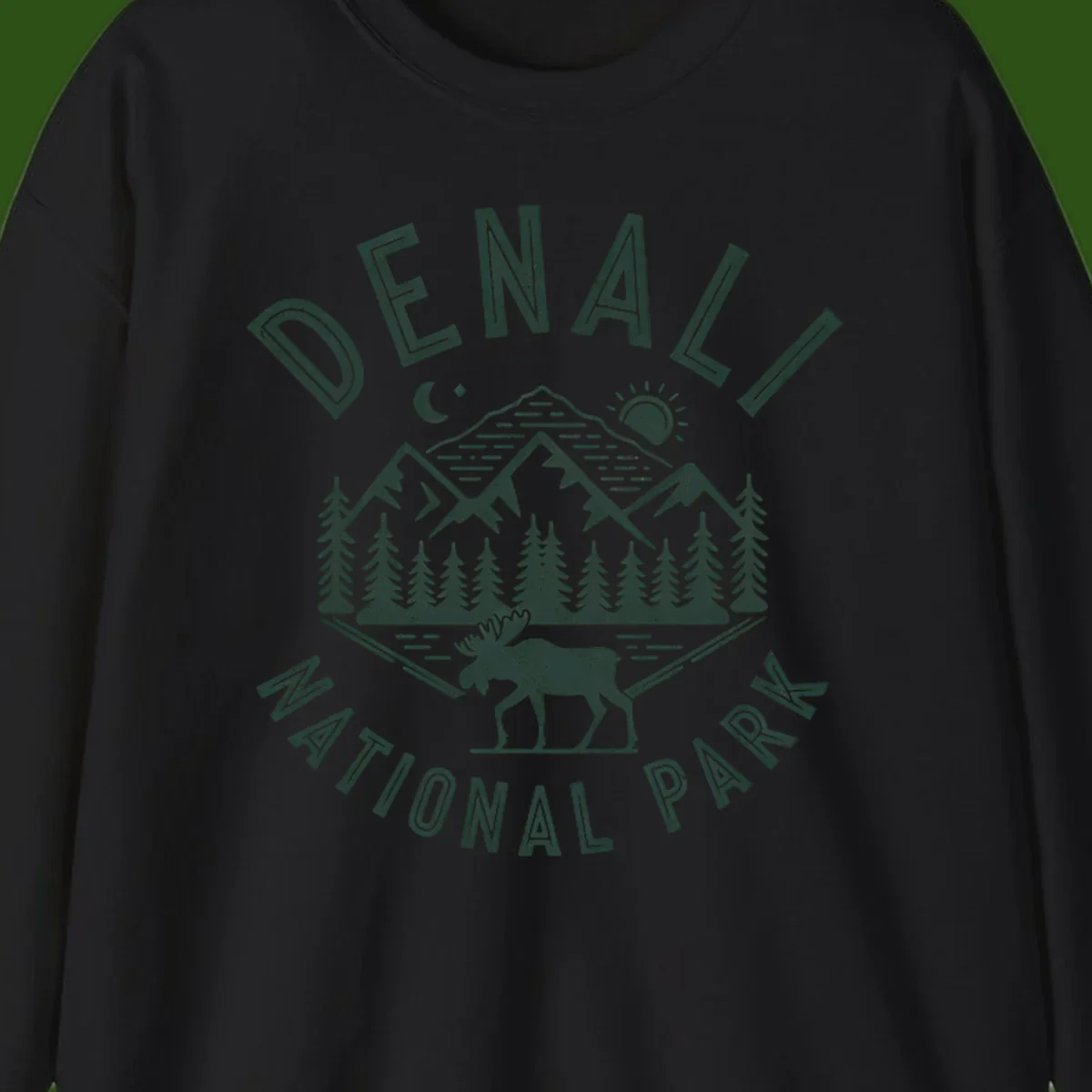 Denial National Park badge design with moose walking through forest, mountains, sun and moon with crossed fishing rods