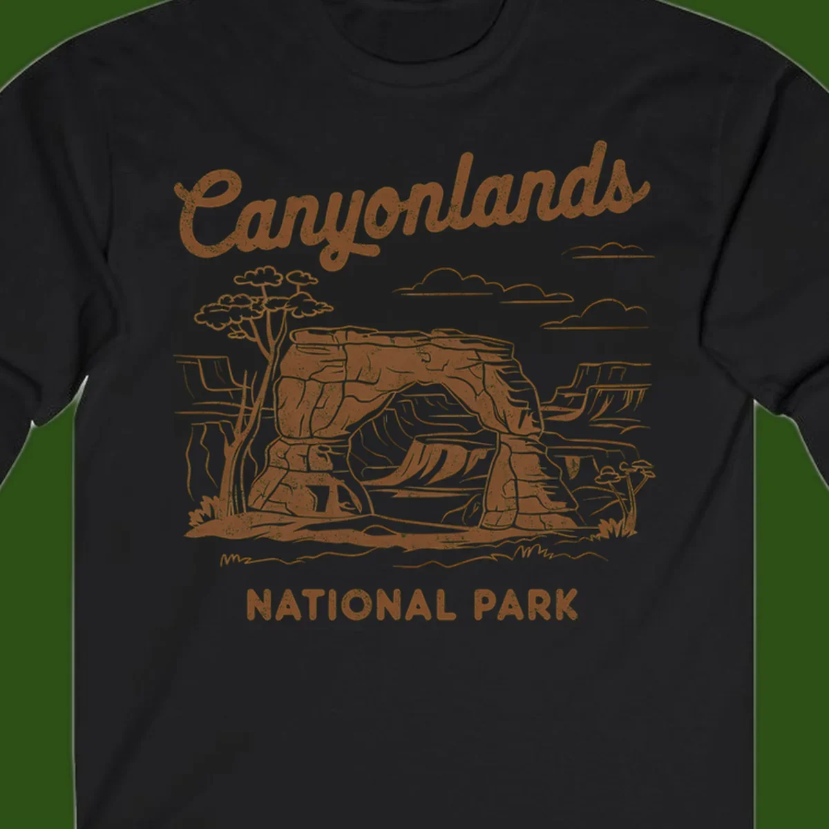 Vintage illustration of Canyonlands National Park featuring layered red rock canyon formations, desert acacia tree, and clouds in rust orange line art.