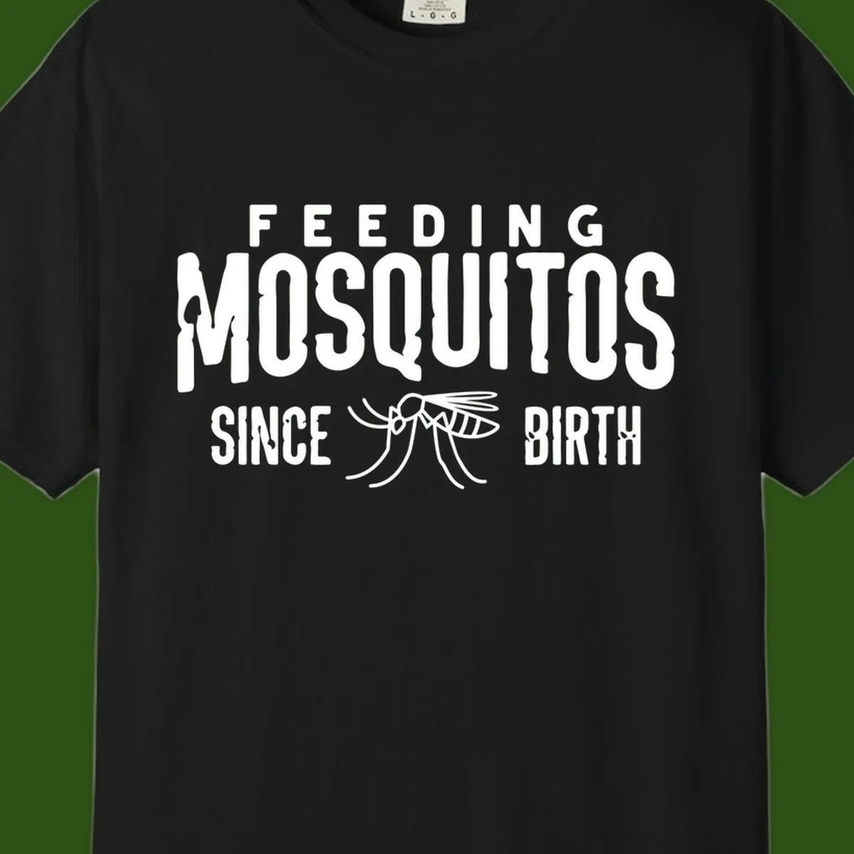 Feeding mosquitos since birth design with mosquito illustration and bold white text on gray background