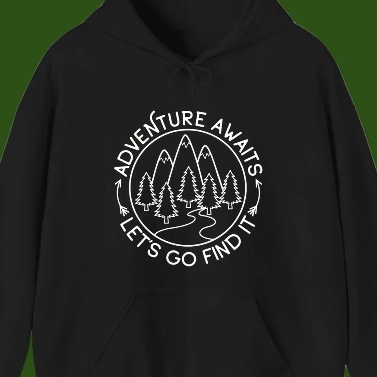 Circular badge with forest scene of evergreen trees and mountains, text reads 'Adventure Awaits Let's Go Find It'