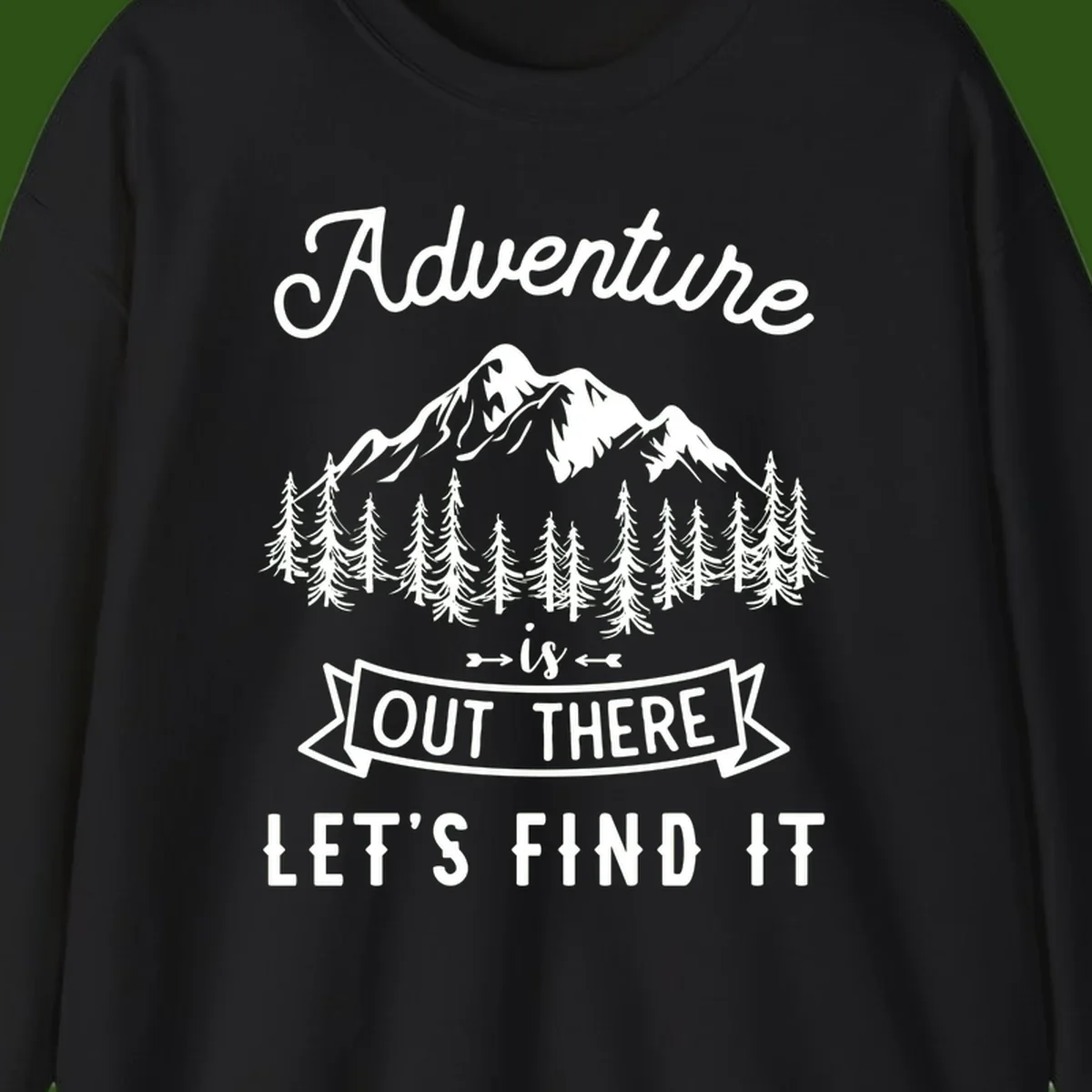 Adventure is out there design with snow mountains, pine forest, and text saying let's find it
