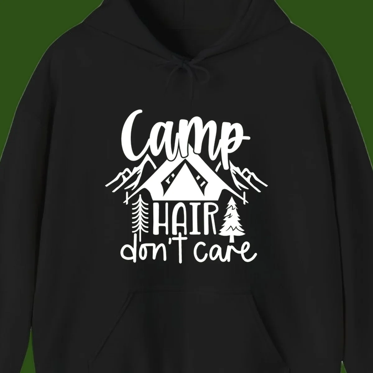 Camp hair don't care design with tent, mountains, pine trees, and campfire illustration with cursive text