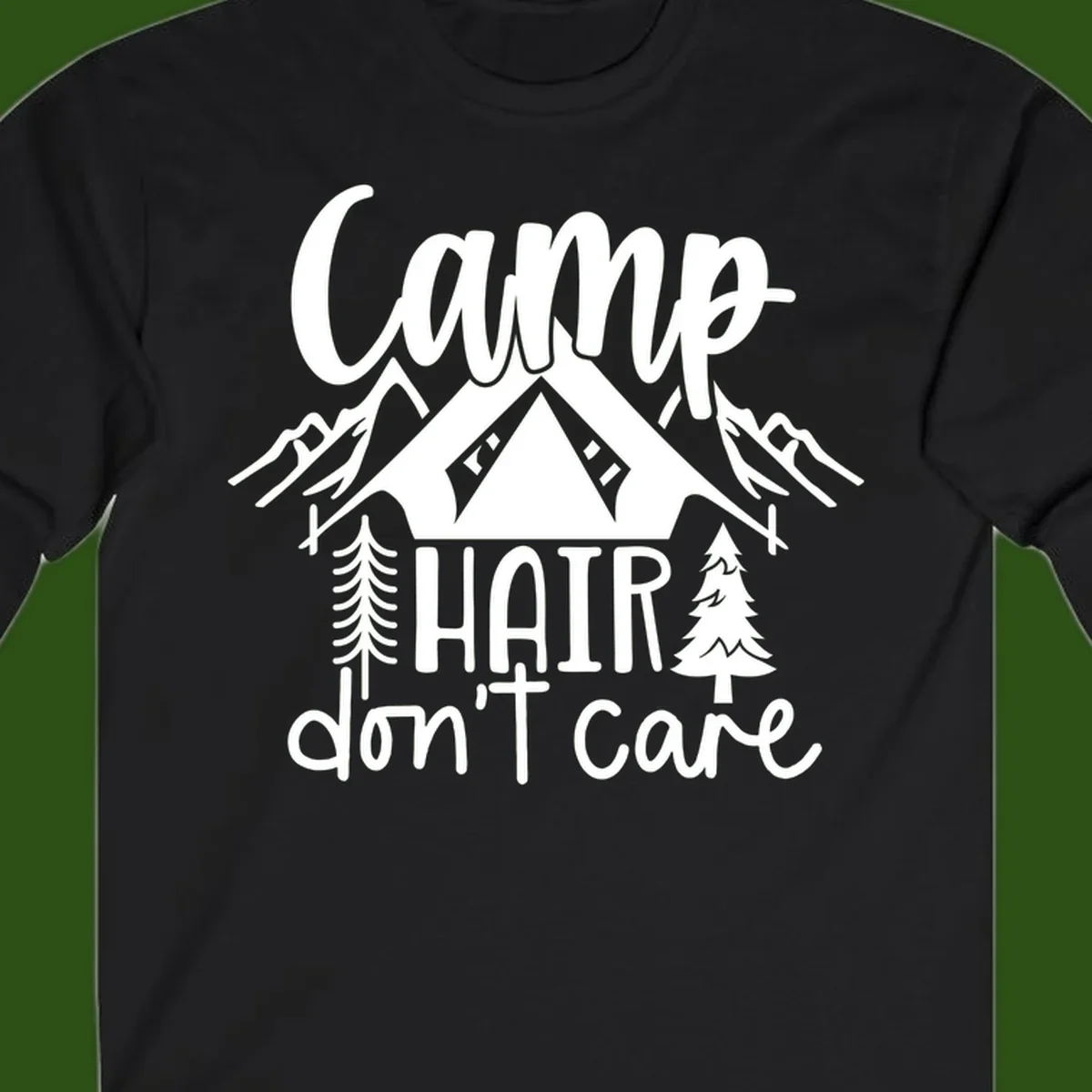 Camp hair don't care design with tent, mountains, pine trees, and campfire illustration with cursive text