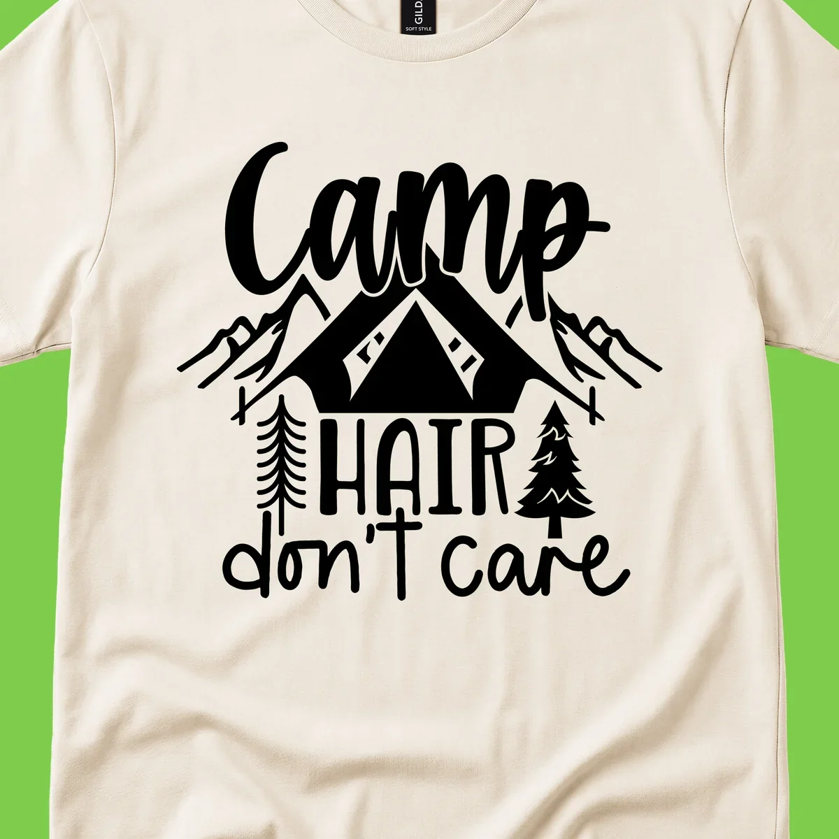 Camp hair don't care design with tent, mountains, pine trees, and campfire illustration with cursive text