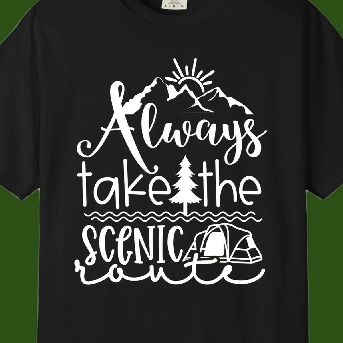 White line art design with mountains, sun, pine tree, tent, and water featuring 'Always take the scenic route' script text