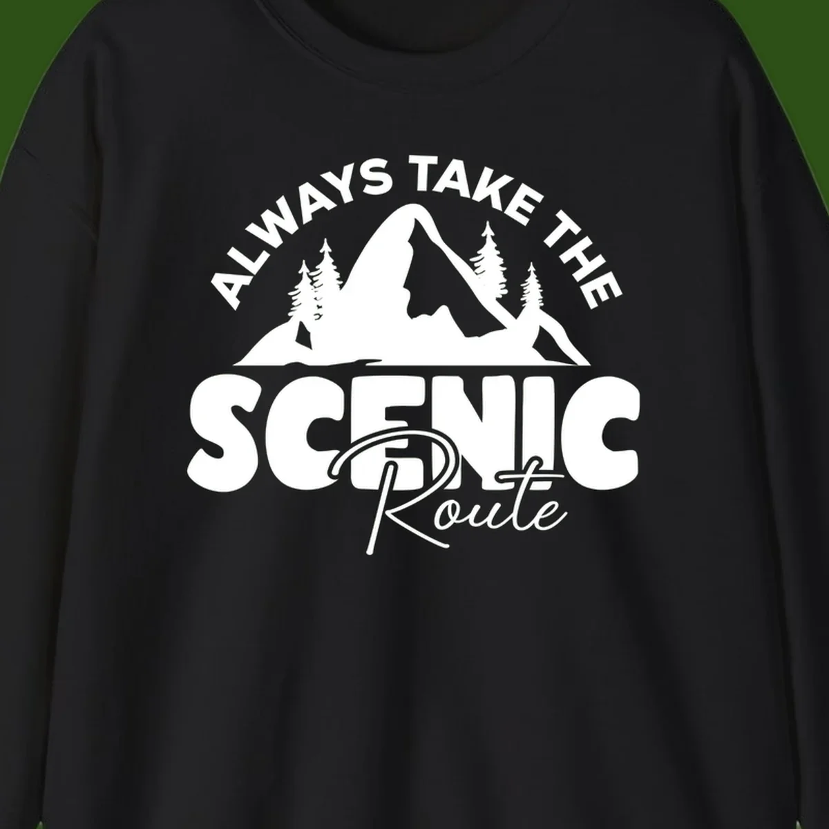White mountain landscape illustration with evergreen trees and text reading 'All Ways Take The Scenic Route' on gray background