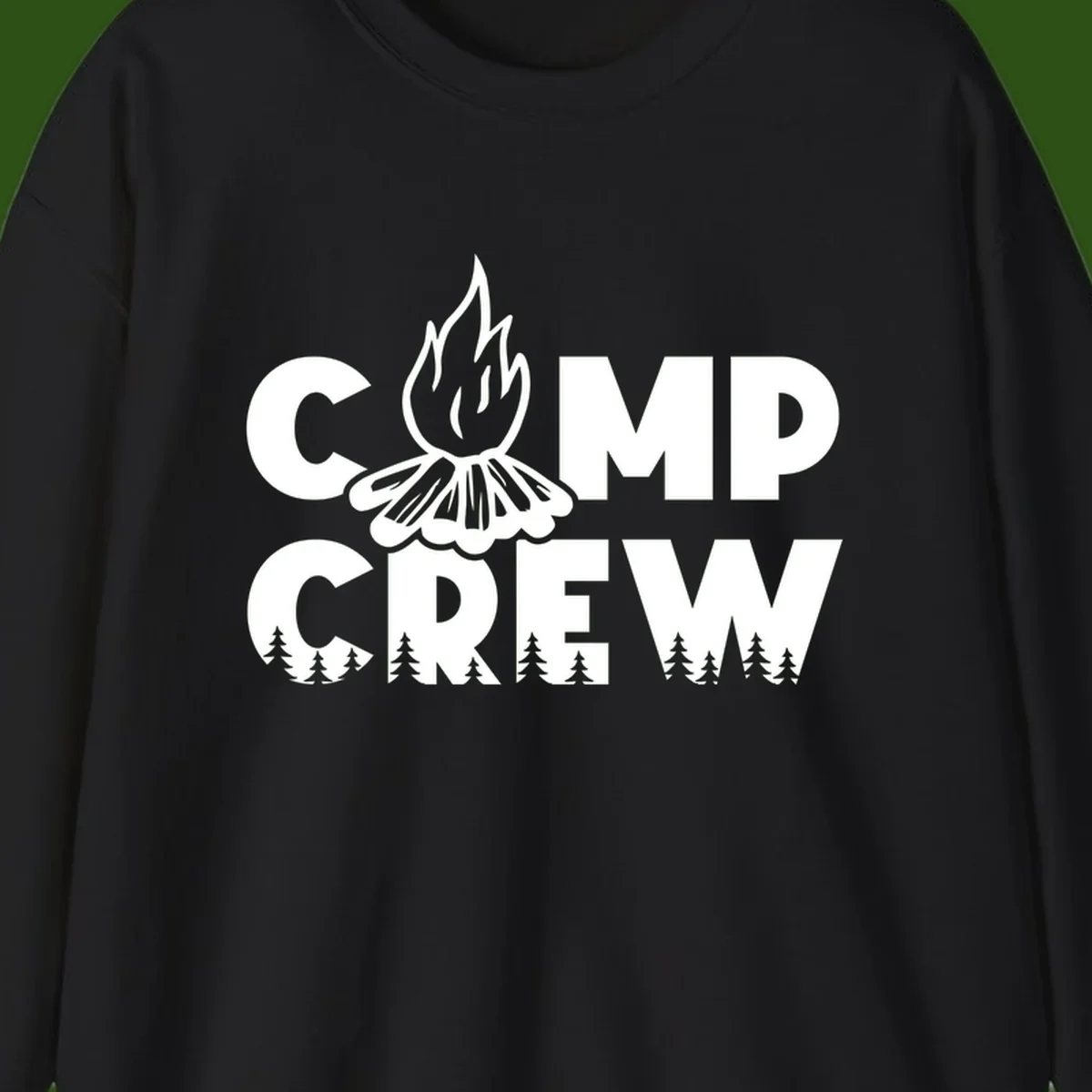 Camp Crew campfire design with stylized flames, flower bloom, and pine trees on gray background