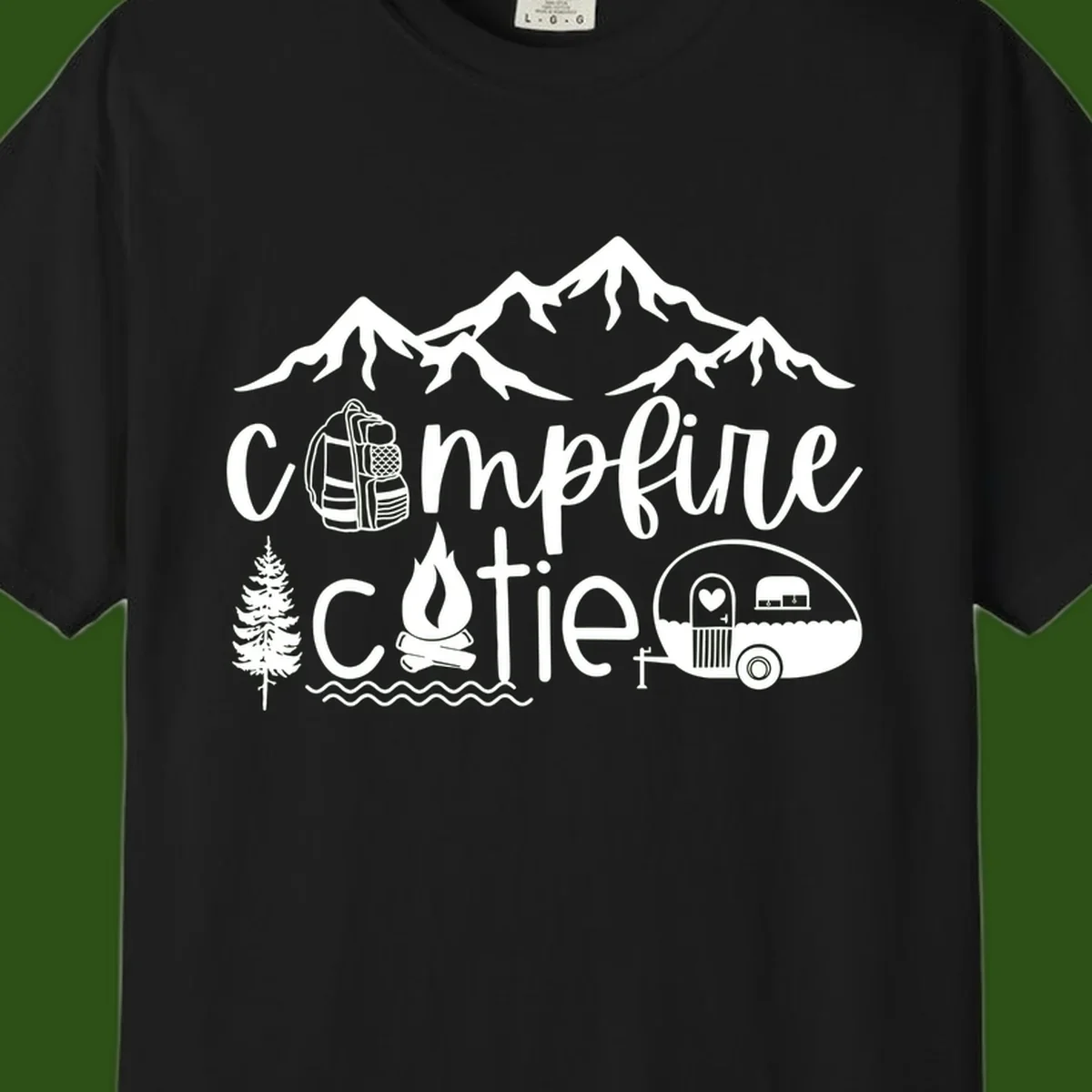 Campfire cutie camping design with mountains, backpack, camper trailer, campfire, and pine tree in white on gray background