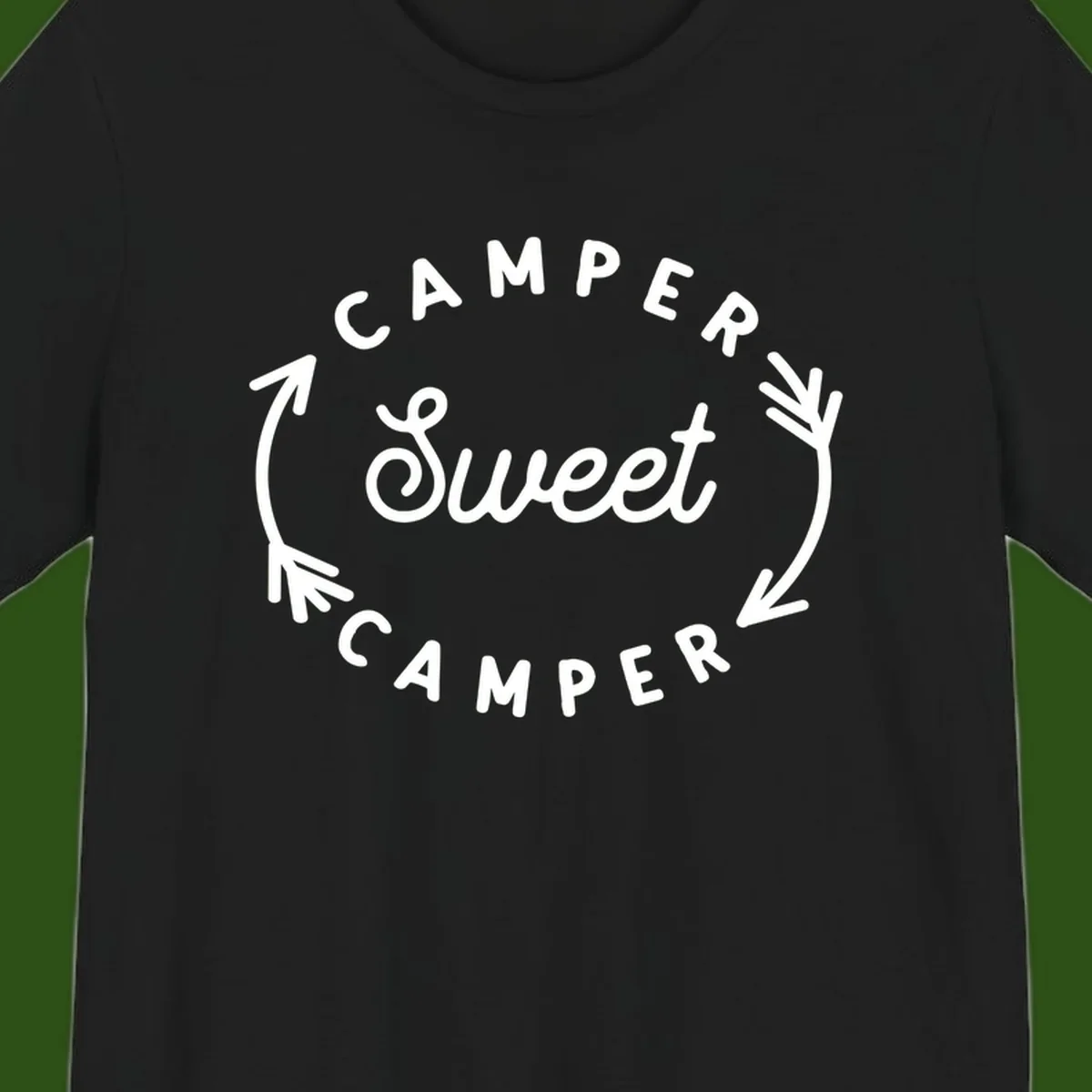 Circular badge design with 'Camper Sweet Camper' text and pine branch decorations in white on gray background