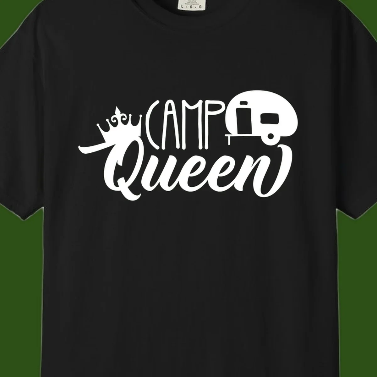 Camp queen glamping design with crown, vintage RV trailer, and script lettering on gray background