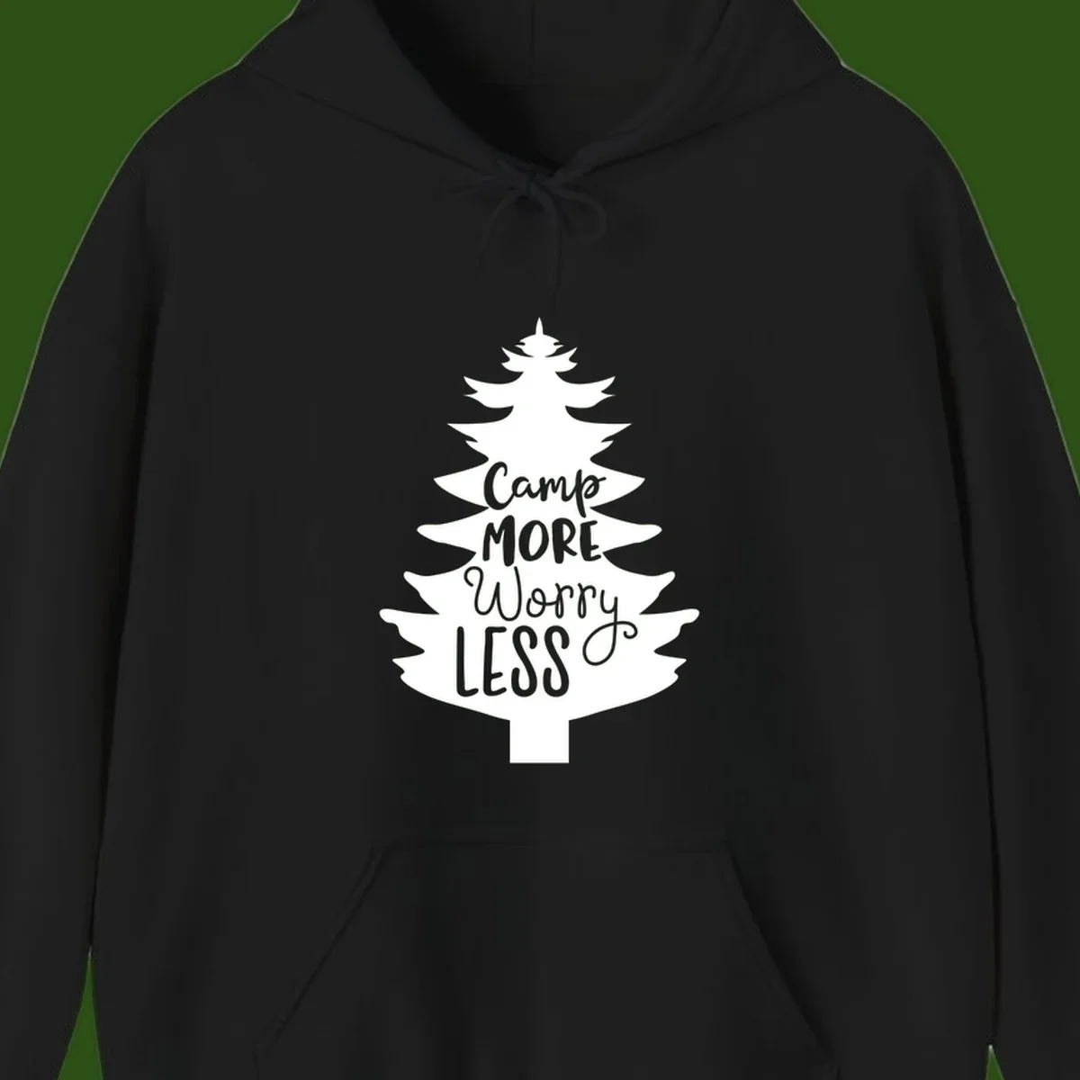 White evergreen tree silhouette with text reading 'Camp MORE Worry LESS' centered in the branches on gray background