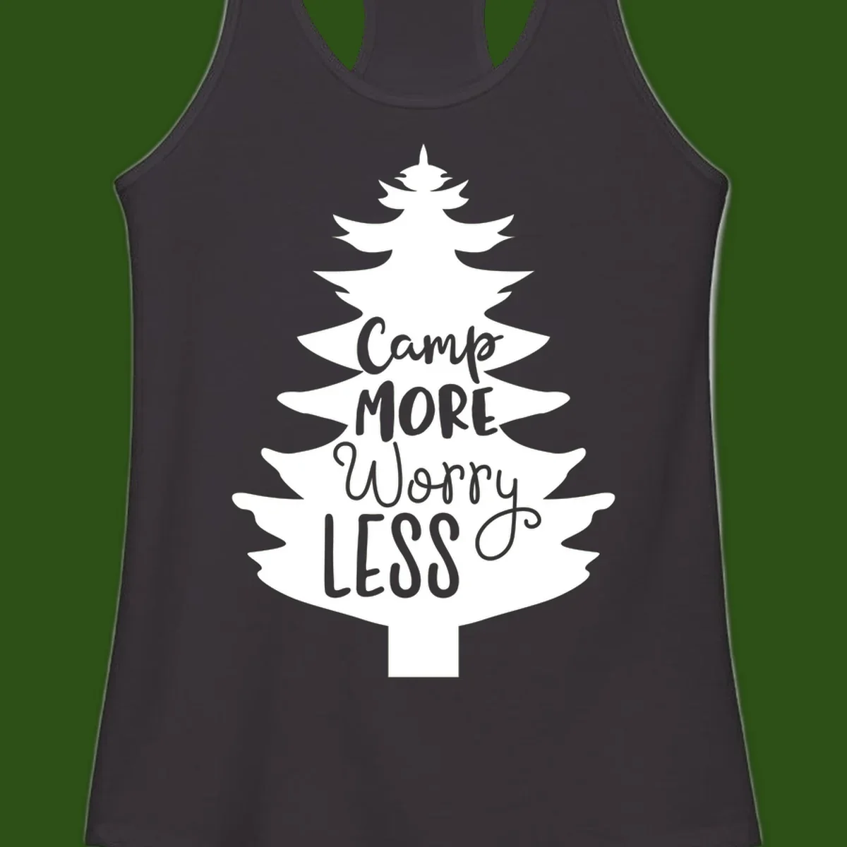 White evergreen tree silhouette with text reading 'Camp MORE Worry LESS' centered in the branches on gray background