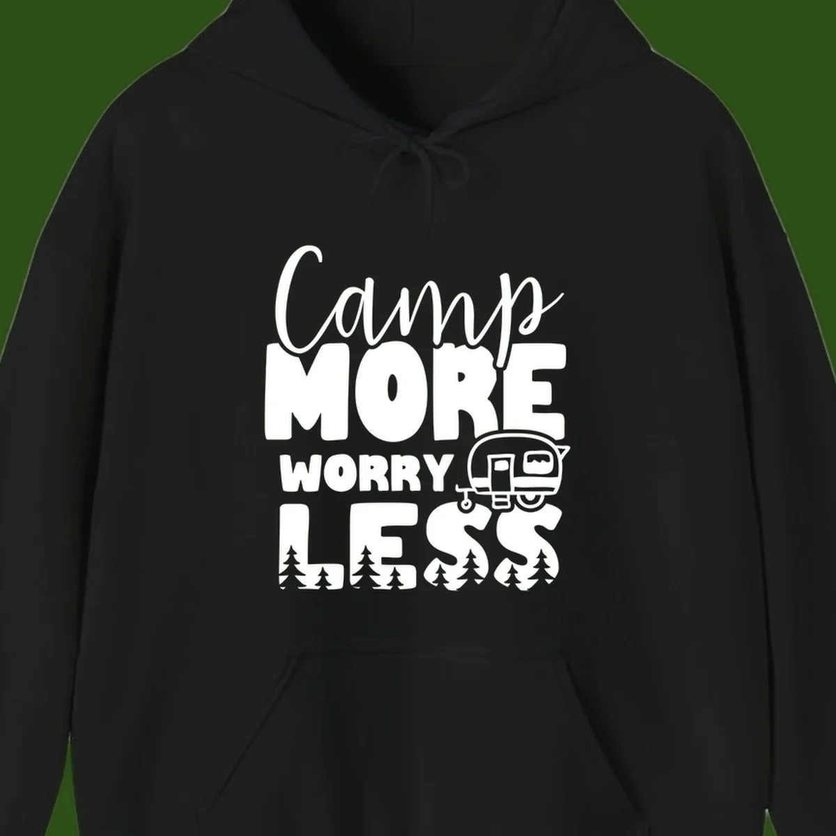 Camp More Worry Less design with flowing script text, camping trailer, and pine trees on gray background