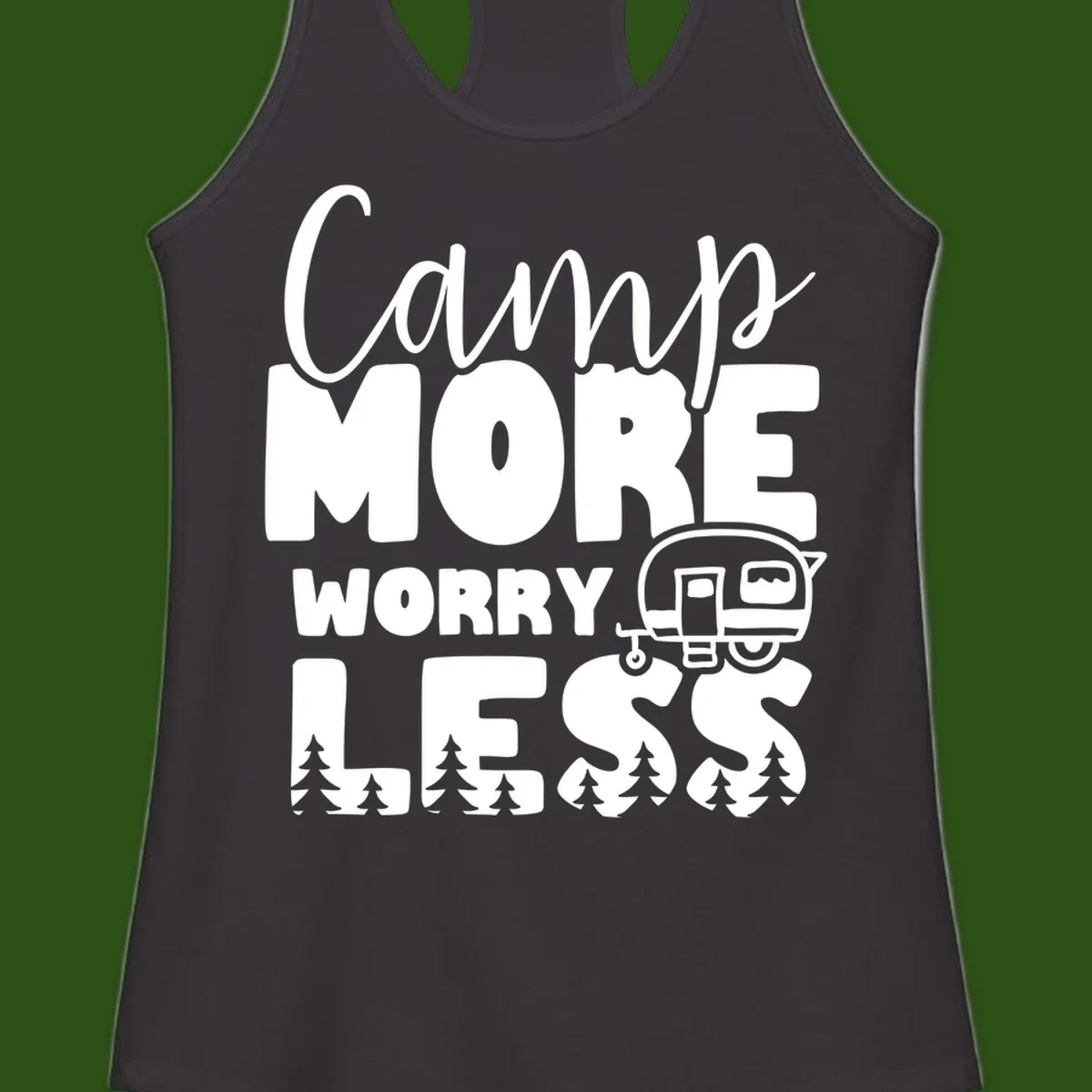 Camp More Worry Less design with flowing script text, camping trailer, and pine trees on gray background