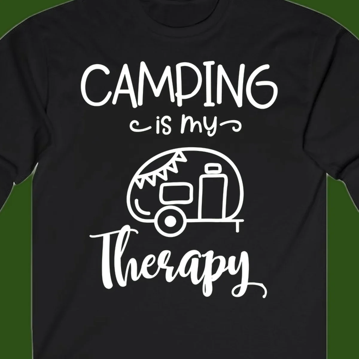 White line drawing of vintage travel trailer with bunting and text reading 'Camping is my Therapy' on gray background