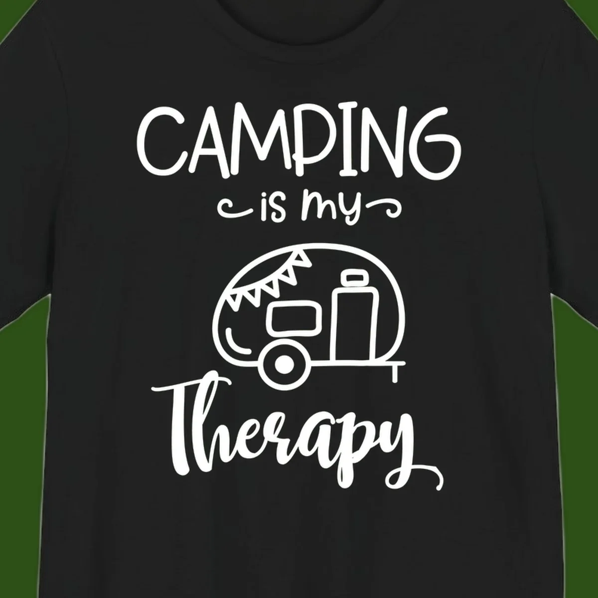 White line drawing of vintage travel trailer with bunting and text reading 'Camping is my Therapy' on gray background