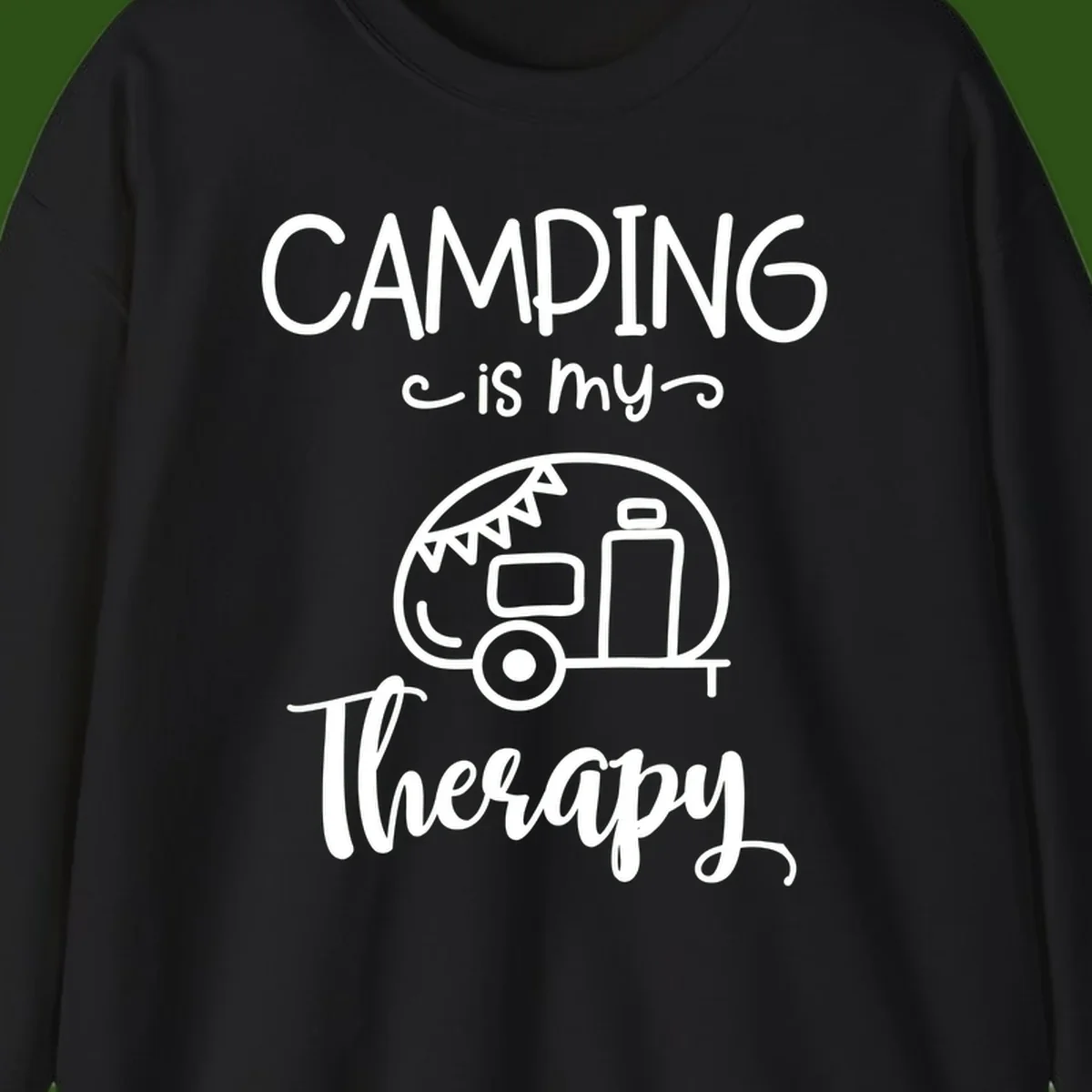 White line drawing of vintage travel trailer with bunting and text reading 'Camping is my Therapy' on gray background
