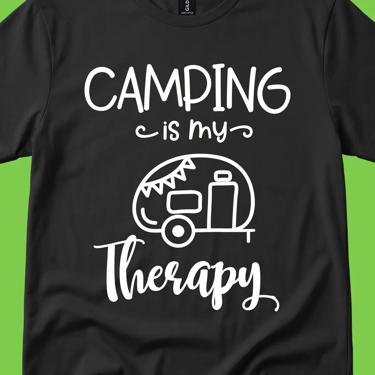White line drawing of vintage travel trailer with bunting and text reading 'Camping is my Therapy' on gray background