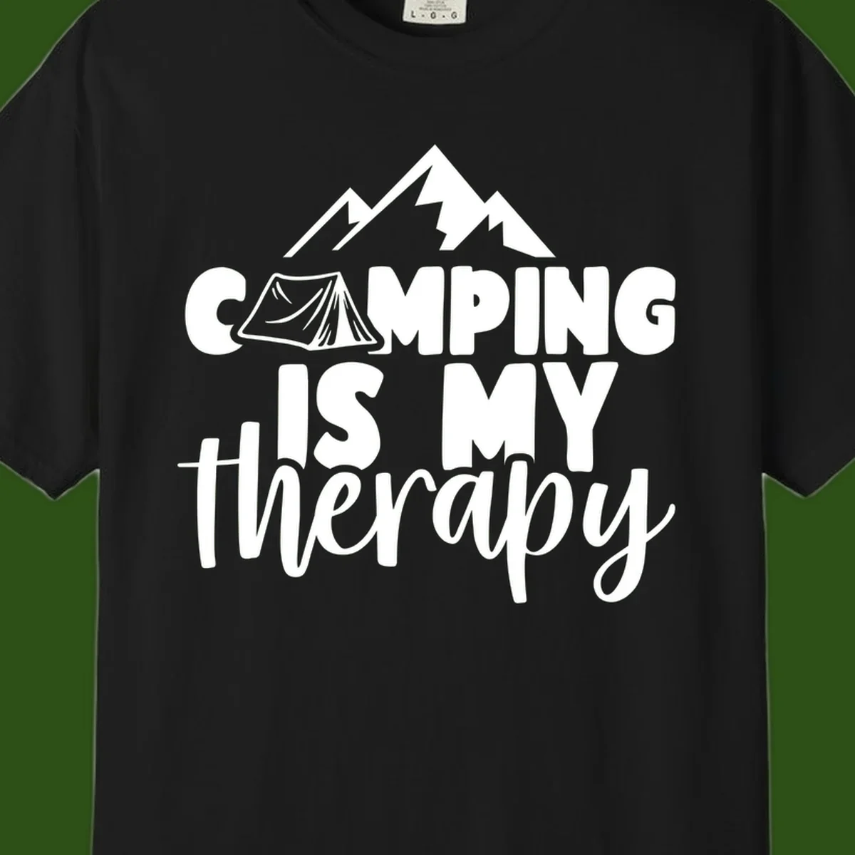 White text reading 'Camping Is My Therapy' with tent and mountain graphic design on gray background